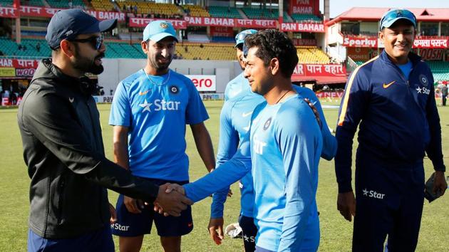 Virat Kohli with debutant Kuldeep Yadav at the start of day one of the fourth test match between India and Australia. (BCCI)