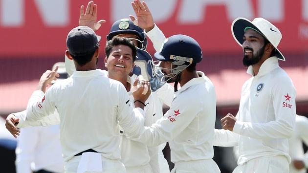 An emotional Kuldeep Yadav celebrates his maiden test wicket after dismissing David Warner of Australia. (BCCI)