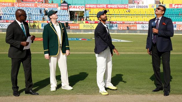 Indian captain Ajinkya Rahane and Australian captain Steven Smith during the toss. (BCCI)