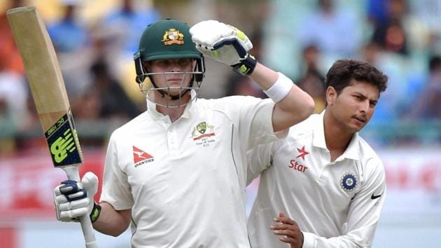 Australia captainSteve Smith and India’s Kuldeep Yadav during the first day of last test match against India at HPCA Stadium in Dharamsala on Saturday.(PTI)