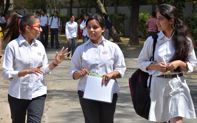 Students coming out of an examination centre in Gurgaon after appearing for the CBSE class 12 chemistry paper on Saturday. ( (Parveen Kumar/HT Photo) Students coming out of an examination centre in Gurgaon after appearing for the CBSE class 12 chemistry paper on Saturday. ( (Parveen Kumar/HT Photo)