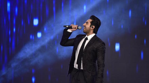 Everyone knows that he is multi-talented, and Ayushmann Khurrana did not disappoint by showing off his  singing prowess on stage.   (Satish Bate/HT Photo) 