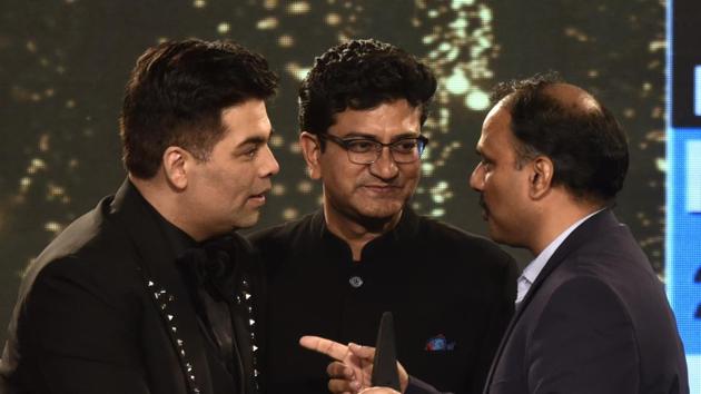 Filmmaker Karan Johar and lyricist Prasoon Joshi also took up the stage, and were twinning in black for the night.   (Satish Bate/HT Photo) 