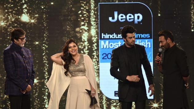 Spot the icons! Host for the night, Manish Paul, in conversation with actors Amitabh Bachchan, Kajol and Ajay Devgn. (Satish Bate/HT Photo) 