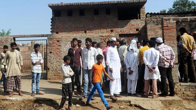 Muslim butchers and traders with family members gather outside a closed illegal slaughter house at Naini in Allahabad. (AFP) Muslim butchers and traders with family members gather outside a closed illegal slaughter house at Naini in Allahabad. (AFP)