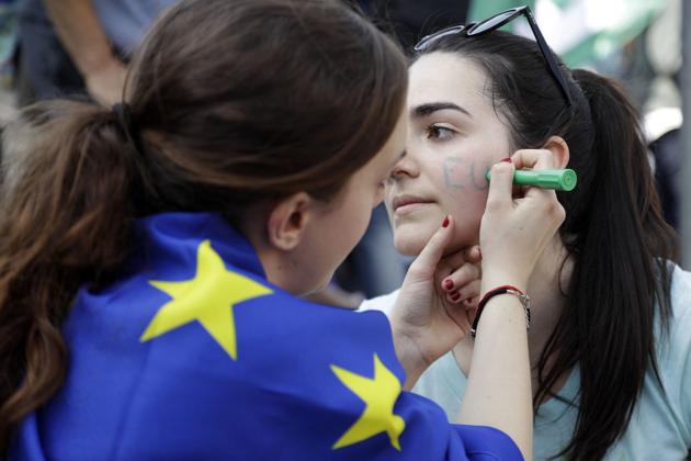EU supporters in Rome prepare themselves as the leaders of member states gather in the city for the bloc’s 60th anniversary. (AP) EU supporters in Rome prepare themselves as the leaders of member states gather in the city for the bloc’s 60th anniversary. (AP)