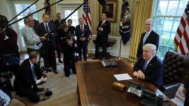 US President Donald Trump talks to journalists at the Oval Office of the White House after the AHCA health care bill was pulled before a vote in Washington.(REUTERS)