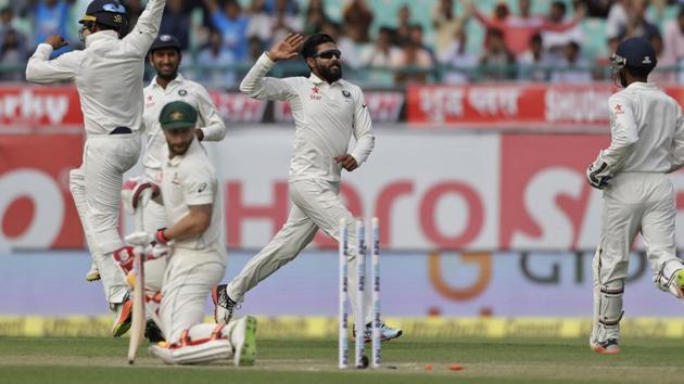 Ravindra Jadeja, center, celebrates the dismissal of Australia's Matthew Wade. (AP)