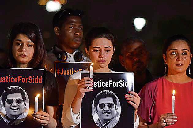 Family members and friends of Sidharth Sharma, a 32-year-old IT professional who was killed after he was hit by a speeding Mercedes, hold a protest for justice at Central Park, Connaught Place, New Delhi, on Sunday.(Sanjeev Verma/ HT Photo) Family members and friends of Sidharth Sharma, a 32-year-old IT professional who was killed after he was hit by a speeding Mercedes, hold a protest for justice at Central Park, Connaught Place, New Delhi, on Sunday.(Sanjeev Verma/ HT Photo)