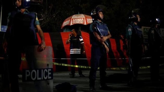 A security personnel talks over a walky-talky while others stand guard in front of the spot where a suicide bomber blew himself up near the Shahjalal International Airport in Dhaka, Bangladesh, on March 24, 2017. (Reuters) A security personnel talks over a walky-talky while others stand guard in front of the spot where a suicide bomber blew himself up near the Shahjalal International Airport in Dhaka, Bangladesh, on March 24, 2017. (Reuters)