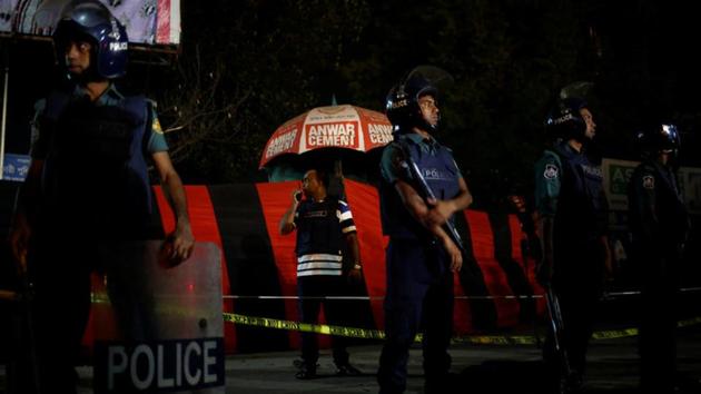 A security personnel talks over a walky-talky while others stand guard in front of the spot where a suicide bomber blew himself up near the Shahjalal International Airport in Dhaka on March 24. A day after the attack, army commandos raided an Islamist extremist hideout in Sylhet. (REUTERS) A security personnel talks over a walky-talky while others stand guard in front of the spot where a suicide bomber blew himself up near the Shahjalal International Airport in Dhaka on March 24. A day after the attack, army commandos raided an Islamist extremist hideout in Sylhet. (REUTERS)