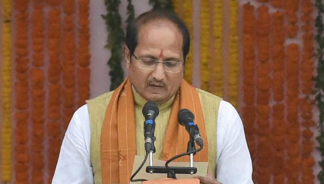 Suresh Rana taking oath as a cabinet minister in Uttar Pradesh government, during the swearing-in ceremony in Lucknow on Sunday.(PTI) Suresh Rana taking oath as a cabinet minister in Uttar Pradesh government, during the swearing-in ceremony in Lucknow on Sunday.(PTI)