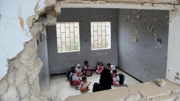 Yemeni students study in a classroom in the Yemeni port city of Hodeidah, on March 15, 2016, which was damaged in the country's ongoing conflict between the Saudi-led Arab coalition fighting Shiite Huthi rebels. The conflict in Yemen, which escalated with the intervention of the Saudi-led coalition two years ago, has more than doubled the number of children deprived of schooling to some 3.5 million, threatening the future of a whole generation in the impoverished country. (AFP) 