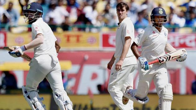 KL Rahul and Cheteshwar Pujara take a run during the second day of fourth Test match against Australia. (PTI) KL Rahul and Cheteshwar Pujara take a run during the second day of fourth Test match against Australia. (PTI)
