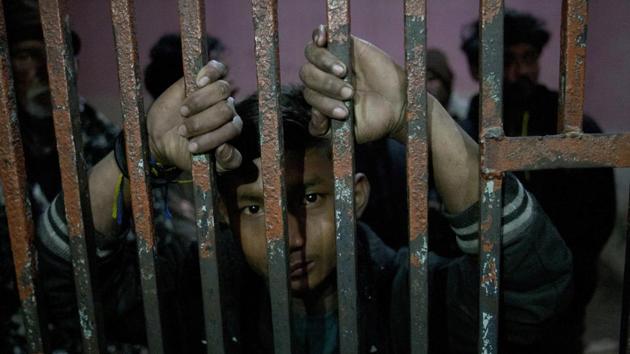 An arrested Indian fishermen looks out at a lock up at a police station in Karachi, Pakistan, on January 27.(AP File Photo) An arrested Indian fishermen looks out at a lock up at a police station in Karachi, Pakistan, on January 27.(AP File Photo)