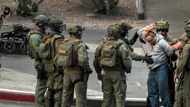 Suspect surrenders to SWAT officers after the shooting near the Cosmopolitan hotel-casino in Las Vegas. (AP Photo) Suspect surrenders to SWAT officers after the shooting near the Cosmopolitan hotel-casino in Las Vegas. (AP Photo)