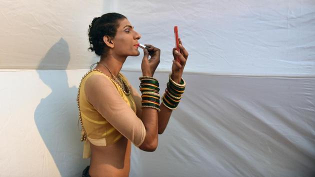 A participant puts on lipstick before the show. (Pratham Gokhale/HT Photo) 