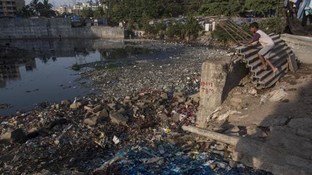 Untreated industrial effluents, blue in colour, flow into the Mithi at Ashok Nagar, Marol. (Satish Bate/HT Photo) 