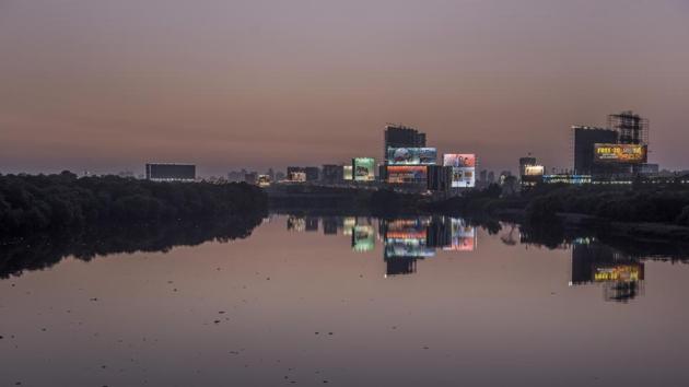 The bright lights of the city bid the river farewell as it flows into the sea at Mahim. (Satish Bate/HT Photo) 