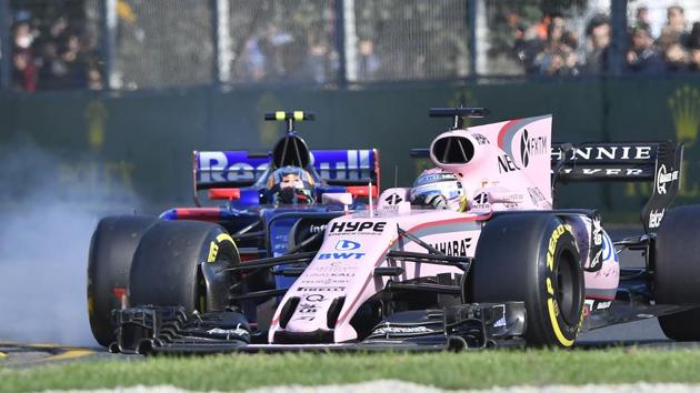 Force India driver Sergio Perez of Mexico during some wheel-to-wheel action during the Formula One Australian Grand Prix at Albert Park in Melbourne on Sunday. (AP) Force India driver Sergio Perez of Mexico during some wheel-to-wheel action during the Formula One Australian Grand Prix at Albert Park in Melbourne on Sunday. (AP)