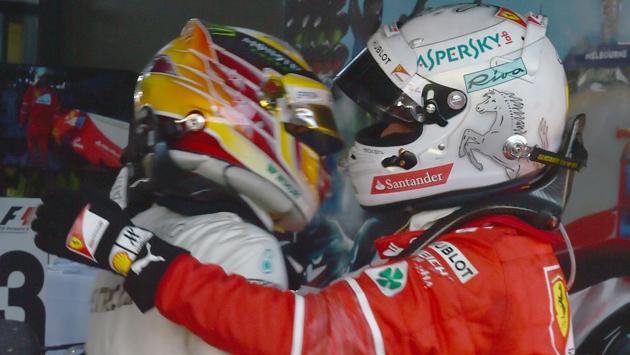 Mercedes’ Lewis Hamilton congratulates Ferrari's Sebastian Vettel (R) Formula One Australian Grand Prix at Albert Park in Melbourne on Sunday. (AFP) Mercedes’ Lewis Hamilton congratulates Ferrari's Sebastian Vettel (R) Formula One Australian Grand Prix at Albert Park in Melbourne on Sunday. (AFP)