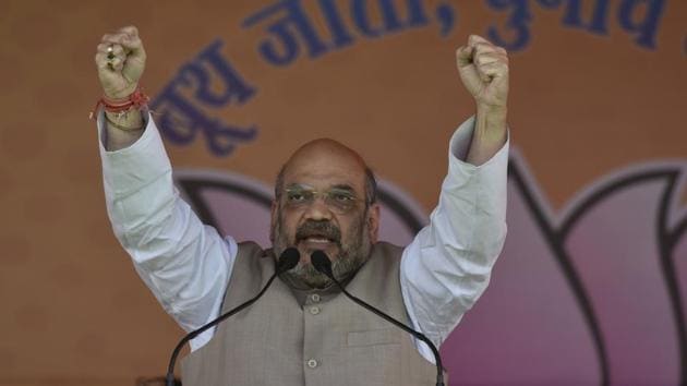BJP National president Amit Shah speaks during the Panch Parmeshwaar Booth Sammelan for the MCD election at Ramlila Ground in New Delhi on March 25.(Vipin Kumar/HT PHOTO)