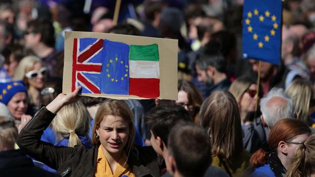 A demonstrator holds a placard bearing a Union, EU during an anti Brexit, pro-European Union (EU) march in London. The Unite for Europe march, which saw many people carrying bright blue EU flags, came just days before Britain is expected to begin its formal separation from the other 27 nations in the EU. (Daniel Leal-Olivas/AFP) A demonstrator holds a placard bearing a Union, EU during an anti Brexit, pro-European Union (EU) march in London. The Unite for Europe march, which saw many people carrying bright blue EU flags, came just days before Britain is expected to begin its formal separation from the other 27 nations in the EU. (Daniel Leal-Olivas/AFP)