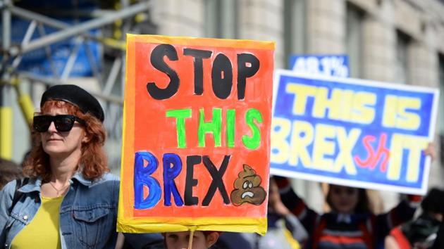 Demonstrators hold placards as they prepare to participate in an anti Brexit, pro-European Union (EU) march. Liberal Democrat leader Tim Farron told the crowd that ‘democracy continues’ despite the assault. ‘We stand in defiance of that attack, he said. (Chris J Ratcliffe/AFP) Demonstrators hold placards as they prepare to participate in an anti Brexit, pro-European Union (EU) march. Liberal Democrat leader Tim Farron told the crowd that ‘democracy continues’ despite the assault. ‘We stand in defiance of that attack, he said. (Chris J Ratcliffe/AFP)