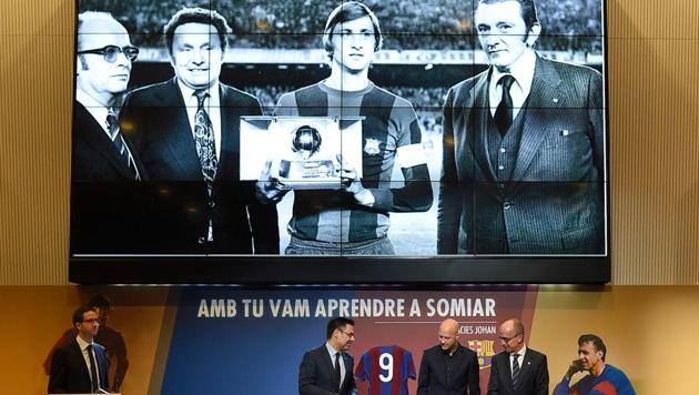 Jordi Cruyff (second right), son of late Dutch great Johan Cruyff, Jposes with Barcelona's president Josep Maria Bartomeu (second left) and Barcelona's vice president Jordi Cardoner (right) next to the "Ballon d'Or" that his father received in 1974 during a ceremony for the first anniversary of Johan Cruyff's death at Camp Nou stadium in Barcelona on Saturday. (AFP) Jordi Cruyff (second right), son of late Dutch great Johan Cruyff, Jposes with Barcelona's president Josep Maria Bartomeu (second left) and Barcelona's vice president Jordi Cardoner (right) next to the "Ballon d'Or" that his father received in 1974 during a ceremony for the first anniversary of Johan Cruyff's death at Camp Nou stadium in Barcelona on Saturday. (AFP)