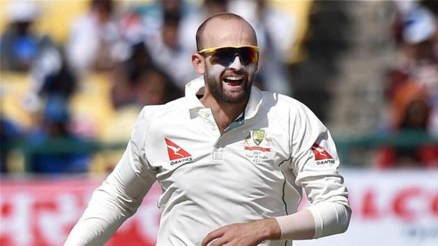 Australian spinner Nathan Lyon celebrates the wicket of India's Cheteshwar Pujara during the second day of last Test match at HPCA Stadium in Dharamshala on Sunday.(PTI)