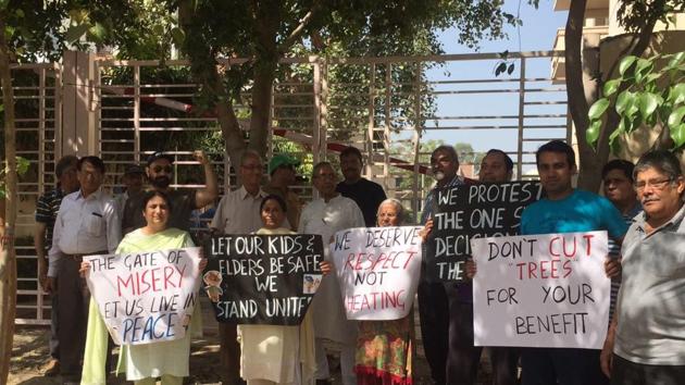 Residents of Block A of Sushant Lok 1 protested outside the Ivy Tower gate. Residents of Block A of Sushant Lok 1 protested outside the Ivy Tower gate.