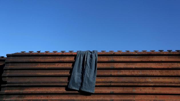 Pants hang on a section of the fence separating Mexico and the United States. (Edgard Garrido/REUTERS) Pants hang on a section of the fence separating Mexico and the United States. (Edgard Garrido/REUTERS)