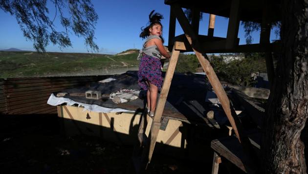A girl climbs stairs near a section of the fence separating Mexico and the United States, in Tijuana, Mexico. The rust-red U.S. fence along the Mexican border has inspired various quirky architectural structures, from a frontier-themed mansion to a humble tree-house with uninterrupted views across the Californian scrubland. (Edgard Garrido/REUTERS) A girl climbs stairs near a section of the fence separating Mexico and the United States, in Tijuana, Mexico. The rust-red U.S. fence along the Mexican border has inspired various quirky architectural structures, from a frontier-themed mansion to a humble tree-house with uninterrupted views across the Californian scrubland. (Edgard Garrido/REUTERS)