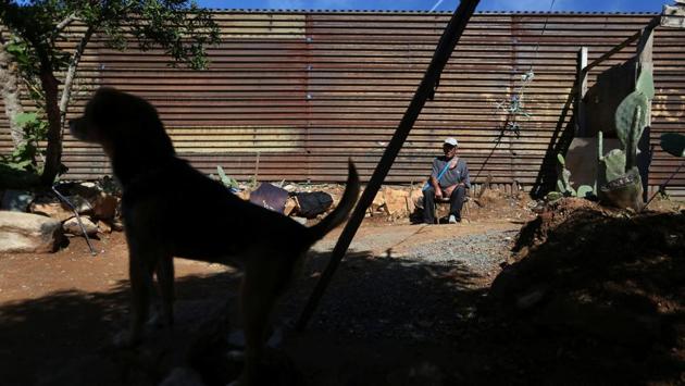 Pensioner Pedro, 72, rests outside his home near a section of the fence separating Mexico and the United States, on the outskirts of Tijuana, Mexico. Neither Trump nor the wall is going to stop anyone, maybe just for a moment, he said. (Edgard Garrido/REUTERS) Pensioner Pedro, 72, rests outside his home near a section of the fence separating Mexico and the United States, on the outskirts of Tijuana, Mexico. Neither Trump nor the wall is going to stop anyone, maybe just for a moment, he said. (Edgard Garrido/REUTERS)