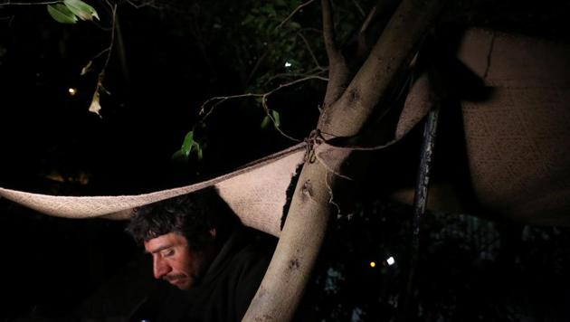 Joaquin, 36, a chef from Guatemala who says he was deported from the United States, sits underneath a tree near a section of the border fence separating Mexico and the United States. (Edgard Garrido/REUTERS) Joaquin, 36, a chef from Guatemala who says he was deported from the United States, sits underneath a tree near a section of the border fence separating Mexico and the United States. (Edgard Garrido/REUTERS)