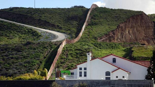 A house stands next to a section of the border fence separating Mexico and the United States. (Edgard Garrido/REUTERS) A house stands next to a section of the border fence separating Mexico and the United States. (Edgard Garrido/REUTERS)