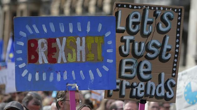 Demonstrators hold placards and wave EU flags as they participate in the march. There was also a smaller anti-Brexit protest march in Edinburgh, Scotland. (Daniel Leal-Olivas/AFP) Demonstrators hold placards and wave EU flags as they participate in the march. There was also a smaller anti-Brexit protest march in Edinburgh, Scotland. (Daniel Leal-Olivas/AFP)