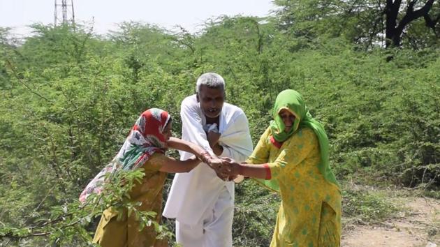 Two women protesting against liquor shop in the village beat up a drunk man in Sonepat on Sunday.(HT Photo)