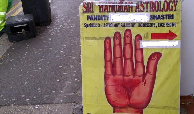 Roadside poster for an astrologer in Hounslow, London. (HT Photo) Roadside poster for an astrologer in Hounslow, London. (HT Photo)