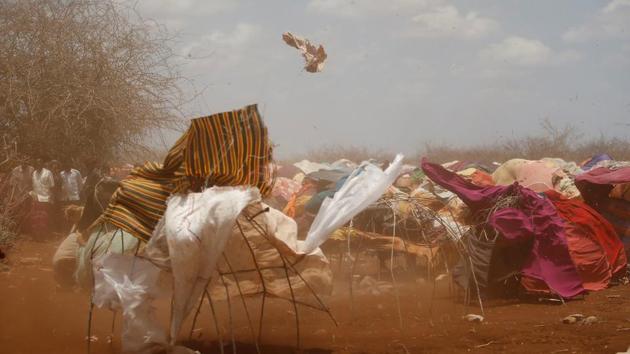 A dust storm sweeps through a makeshift camps in Baidoa, west of Somalia's capital Mogadishu. Thousands of desperate Somalis have streamed into Baidoa in south-western Somalia seeking food and medical care as a result the country’s prolonged drought. The influx has overwhelmed local and international aid agencies. (Feisal Omar/REUTERS)
