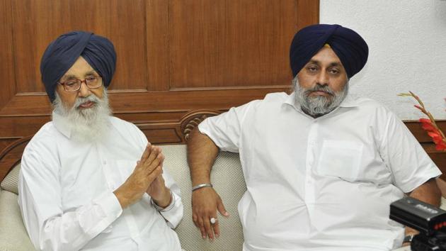 Former Punjab chief minister Parkash Singh Badal and his son Sukhbir Singh Badal talking to mediapersons after taking oath in the office of the assembly speaker on Monday afternoon.(Keshav Singh/HT)