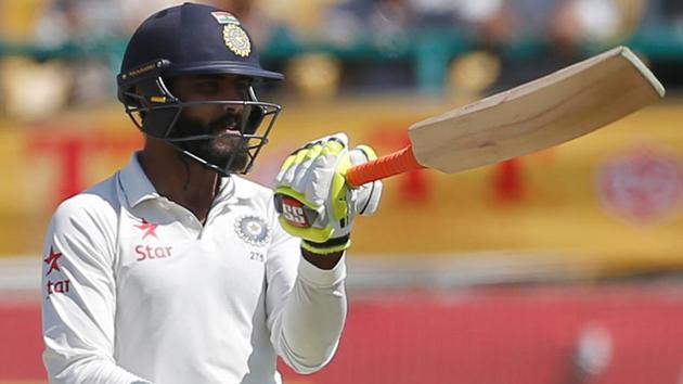 Ravindra Jadeja celebrates his half century in Dharamsala on Monday. India have a 32-run first innings lead in the fourth and final Test vs Australia. Live streaming and live cricket score of the match is available online. Get all live information here.(REUTERS)