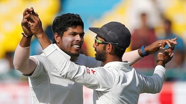 India's Umesh Yadav (left) and Ajinkya Rahane celebrate the dismissal of Australia's Nathan Lyon in Dharamsala on Monday.(Reuters)