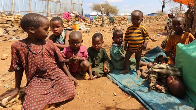 Internally displaced Somali children rest outside their shelter. In recent weeks, aid agencies have started a cholera vaccination campaign across Somalia. (Feisal Omar/REUTERS)
