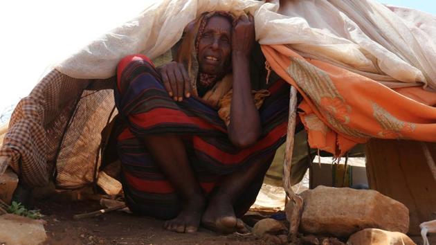 An internally displaced Somali woman rests outside her shelter. Somalia’s drought is threatening 3 million lives, according to the U.N. In recent months, aid agencies have been scaling up their efforts but they say said more support is urgently needed to prevent the crisis from worsening. (Feisal Omar/REUTERS)