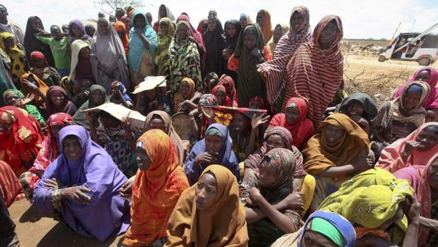 Newly displaced Somali women gather near to their makeshift shelters at a camp in Baidoa, Somalia. We are still ahead of the curve of the famine because now is when we can save lives, he said. This is not the time to have doubts that funding is not needed. (Farah Abdi Warsameh/AP)