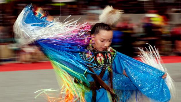 A Native American woman dancer competes during the 43rd Annual Denver March Powwow held at the Denver Coliseum on March 25, 2017 in Denver, Colorado. (Jason Connolly / AFP)