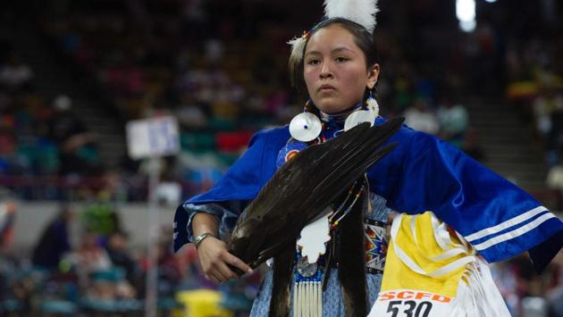 A Native American woman dancer competes during the 43rd Annual Denver March Powwow held at the Denver Coliseum. (Jason Connolly / AFP)