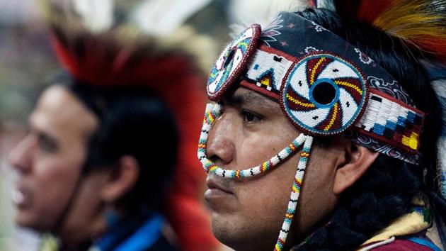 A Native American dancer participates during the Grand Entry of the 43rd Annual Denver March Powwow held at the Denver Coliseum (Jason Connolly / AFP)