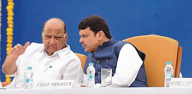 Maharashtra CM Devendra Fadnavis (right) with NCP chief Sharad Pawar during the VSI's general body meeting at Pune on Monday.(HT Photo)